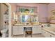 Large main bathroom features a double vanity, a soaking tub, and a glass-enclosed shower at 14680 Linden Dr, Spring Hill, FL 34609