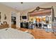 Spacious main bedroom with wood floors, sliding glass doors to the pool, and an en-suite bathroom at 14680 Linden Dr, Spring Hill, FL 34609