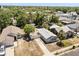 Aerial view of home in neighborhood surrounded by trees at 1465 Pierce St, Clearwater, FL 33755