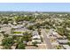 Aerial view of neighborhood with lush greenery and city skyline at 1465 Pierce St, Clearwater, FL 33755