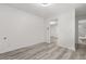 A bright bedroom with neutral walls and modern vinyl plank flooring at 1465 Pierce St, Clearwater, FL 33755