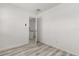 An empty bedroom with neutral walls and vinyl plank flooring at 1465 Pierce St, Clearwater, FL 33755