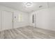Bright bedroom with laminate flooring, neutral paint, and natural light at 1465 Pierce St, Clearwater, FL 33755