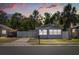 Charming single-story home featuring a fenced yard, well-maintained lawn, and a concrete driveway at 1465 Pierce St, Clearwater, FL 33755