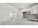 White cabinets, light countertops, and stainless steel appliances adorn this kitchen at 1465 Pierce St, Clearwater, FL 33755