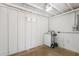 Laundry room with white walls, ceiling, window, and a laundry machine at 1465 Pierce St, Clearwater, FL 33755