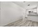Open-concept living room with lots of natural light and laminate wood flooring at 1465 Pierce St, Clearwater, FL 33755