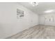 An open-concept living room with bright, natural light and vinyl plank flooring at 1465 Pierce St, Clearwater, FL 33755