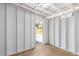 Room interior with wooden floor and open door to outside at 1465 Pierce St, Clearwater, FL 33755