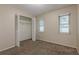 Bedroom with carpet, closet, natural light, and neutral walls at 2006 Sycamore Ln, Plant City, FL 33563