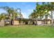 Charming single-story home with lush front lawn and tropical landscaping at 2006 Sycamore Ln, Plant City, FL 33563
