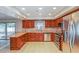 Spacious kitchen featuring granite counters, stainless appliances and wood cabinets at 2006 Sycamore Ln, Plant City, FL 33563