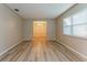 Bright living room with wood floors, neutral walls, and natural light at 2006 Sycamore Ln, Plant City, FL 33563