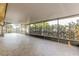 Large screened patio with tile flooring, perfect for outdoor entertaining and relaxation at 2006 Sycamore Ln, Plant City, FL 33563