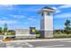 Community entrance sign for Persimmon Park at Wahoo Ranch under a bright blue sky at 28875 Seedling St, Wesley Chapel, FL 33543
