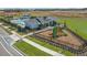 Aerial view of community playground and pool with a lounge area and other neighborhood amenities at 28875 Seedling St, Wesley Chapel, FL 33543