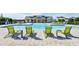 Inviting community pool featuring lounge chairs for relaxing and enjoying the sun at 28875 Seedling St, Wesley Chapel, FL 33543