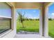 View from covered patio showing a large backyard area at 5329 Companion Ln, Tampa, FL 33619