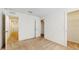 Spacious bedroom featuring neutral carpet, white walls, and a walk-in closet at 5329 Companion Ln, Tampa, FL 33619