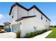 Exterior view of a two-story home with light blue siding and an attached garage at 5329 Companion Ln, Tampa, FL 33619
