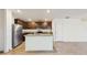 Modern kitchen boasts stainless steel appliances, granite counters, wood cabinets, and an island sink at 5329 Companion Ln, Tampa, FL 33619
