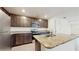 Well-equipped kitchen boasts granite countertops, stainless steel appliances, and plenty of cabinet space at 5329 Companion Ln, Tampa, FL 33619