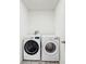 Laundry room featuring a new washer and dryer on wood-look flooring at 5329 Companion Ln, Tampa, FL 33619