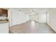 Bright living room features a ceiling fan, wood floors, and white walls, with staircase access visible at 5329 Companion Ln, Tampa, FL 33619