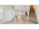 Spacious living area with stairs and a view into other rooms of the house showcasing an open concept at 5329 Companion Ln, Tampa, FL 33619