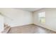 Cozy living room has wood floors, staircase access, and a window that lets in plenty of natural light at 5329 Companion Ln, Tampa, FL 33619