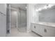 Modern bathroom with double vanity and frameless glass shower enclosure at 1332 W Gray St # 6, Tampa, FL 33606