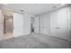 Bright bedroom with carpet, closet, and sliding door to bathroom at 1332 W Gray St # 6, Tampa, FL 33606