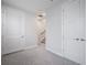 Bright hallway with carpeted floors, closet, and stairway at 1332 W Gray St # 6, Tampa, FL 33606