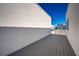 Modern outdoor deck with gray wood-look flooring and white stucco wall at 1332 W Gray St # 6, Tampa, FL 33606