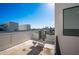 Rooftop with HVAC system and city skyline in background, under a clear blue sky at 1332 W Gray St # 6, Tampa, FL 33606