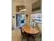 Cozy dining area with wood table, natural light, and view of the office at 8252 Tecumseh Cir, Port Charlotte, FL 33981