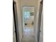 Hallway featuring doors to rooms at the end of hall at 8252 Tecumseh Cir, Port Charlotte, FL 33981