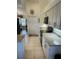 View of kitchen with white cabinets, black appliances, and granite countertops at 8252 Tecumseh Cir, Port Charlotte, FL 33981