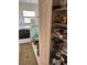 Efficient laundry room provides storage shelves and appliances for your convenience at 8252 Tecumseh Cir, Port Charlotte, FL 33981