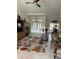 Bright and airy living room with tile floors, high ceilings, and a view of the entry doors at 8252 Tecumseh Cir, Port Charlotte, FL 33981