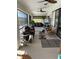 Comfortable screened patio with a ceiling fan, a curious dog and waterfront views at 8252 Tecumseh Cir, Port Charlotte, FL 33981