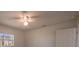 Bright bedroom showcases a ceiling fan, light walls, and a window view at 9235 Richwood Ln, Port Richey, FL 34668