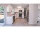 The kitchen features white cabinets and stainless steel appliances at 9235 Richwood Ln, Port Richey, FL 34668