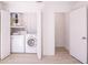 Convenient laundry room is equipped with a modern washer and dryer at 9235 Richwood Ln, Port Richey, FL 34668
