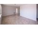 Open-concept living room featuring neutral tile flooring at 9235 Richwood Ln, Port Richey, FL 34668