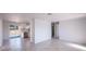 Open living space adjacent to the kitchen and featuring neutral tile flooring at 9235 Richwood Ln, Port Richey, FL 34668