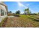 Backyard with landscaping, a patio, a privacy fence, and view of neighborhood at 105 12Th Sw St, Ruskin, FL 33570