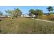 Spacious backyard offering ample green space, modern design, and natural landscaping at 105 12Th Sw St, Ruskin, FL 33570
