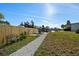 Beautiful waterfront backyard with dock access, bench and path at 105 12Th Sw St, Ruskin, FL 33570