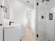 Bathroom featuring a walk-in shower with glass enclosure, modern vanity, and wood-look flooring at 105 12Th Sw St, Ruskin, FL 33570